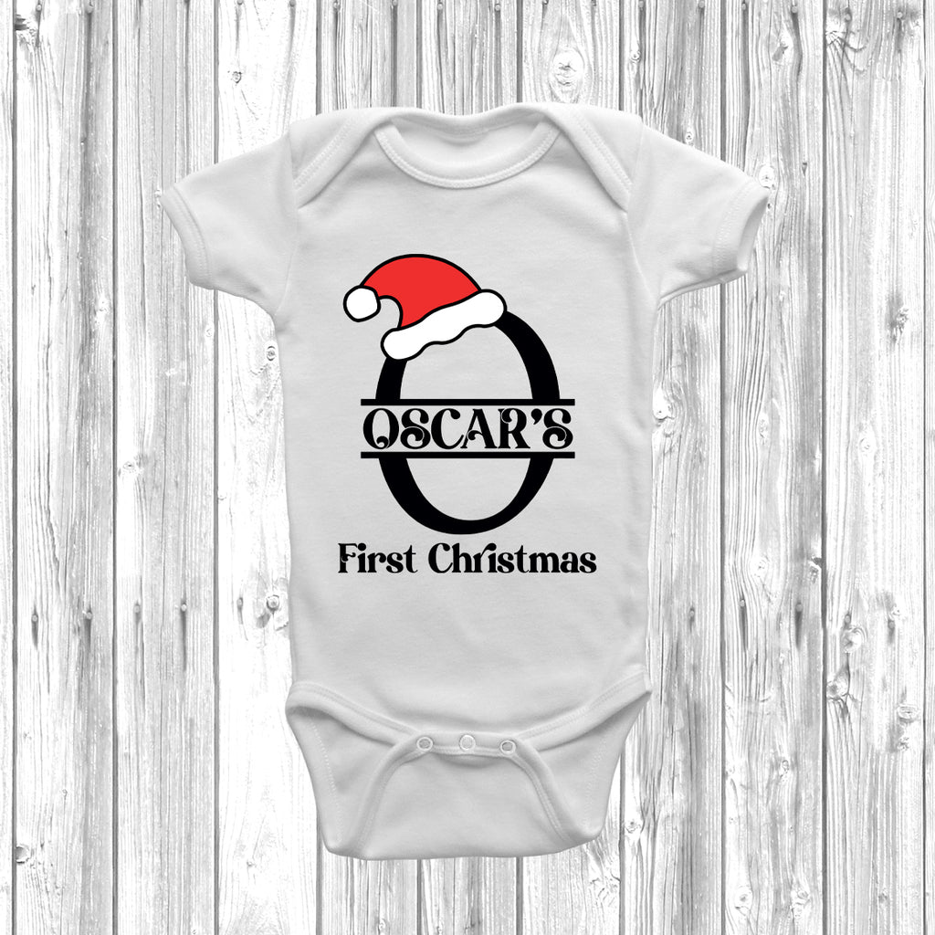 White cotton baby bodysuit with red Santa hat and black lettering