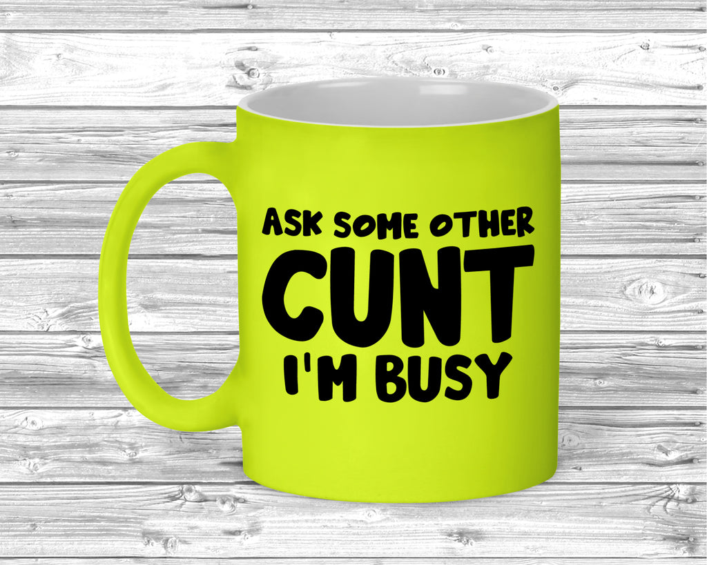 Fluorescent ceramic mug with bold adult humour slogan printed on front.
