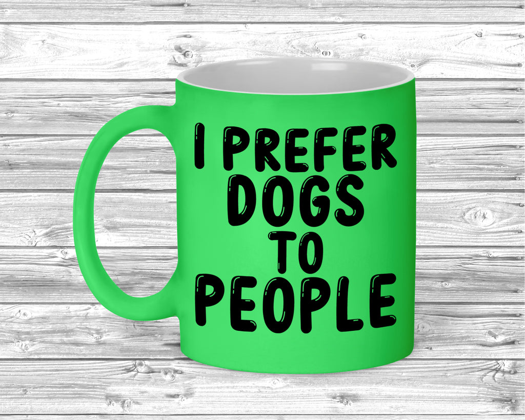 Fluorescent ceramic mug with I Prefer Dogs To People slogan printed on front.