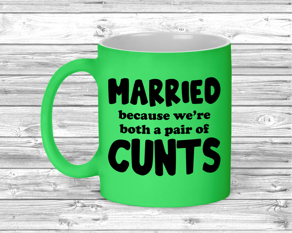 Fluorescent ceramic mug with bold adult humour marriage slogan printed on front.