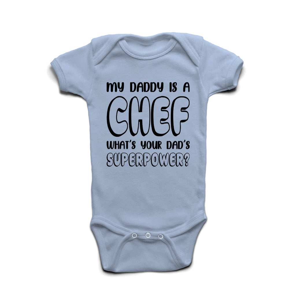 My Daddy Is A Chef What’s Your Superpower baby grow in Pastel Blue cotton with bold print.