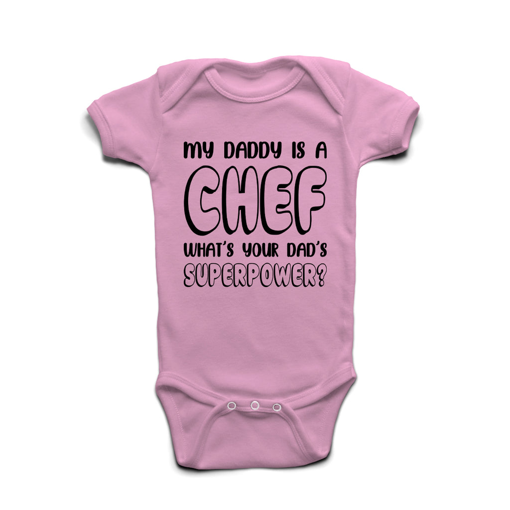 My Daddy Is A Chef What’s Your Superpower baby grow in Pastel Pink cotton with bold print.