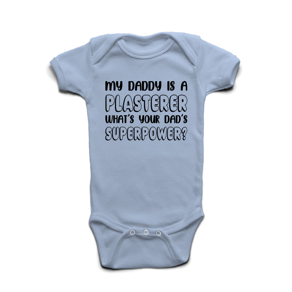 My Daddy Is A Plasterer What’s Your Superpower baby grow in Pastel Blue cotton with bold print.