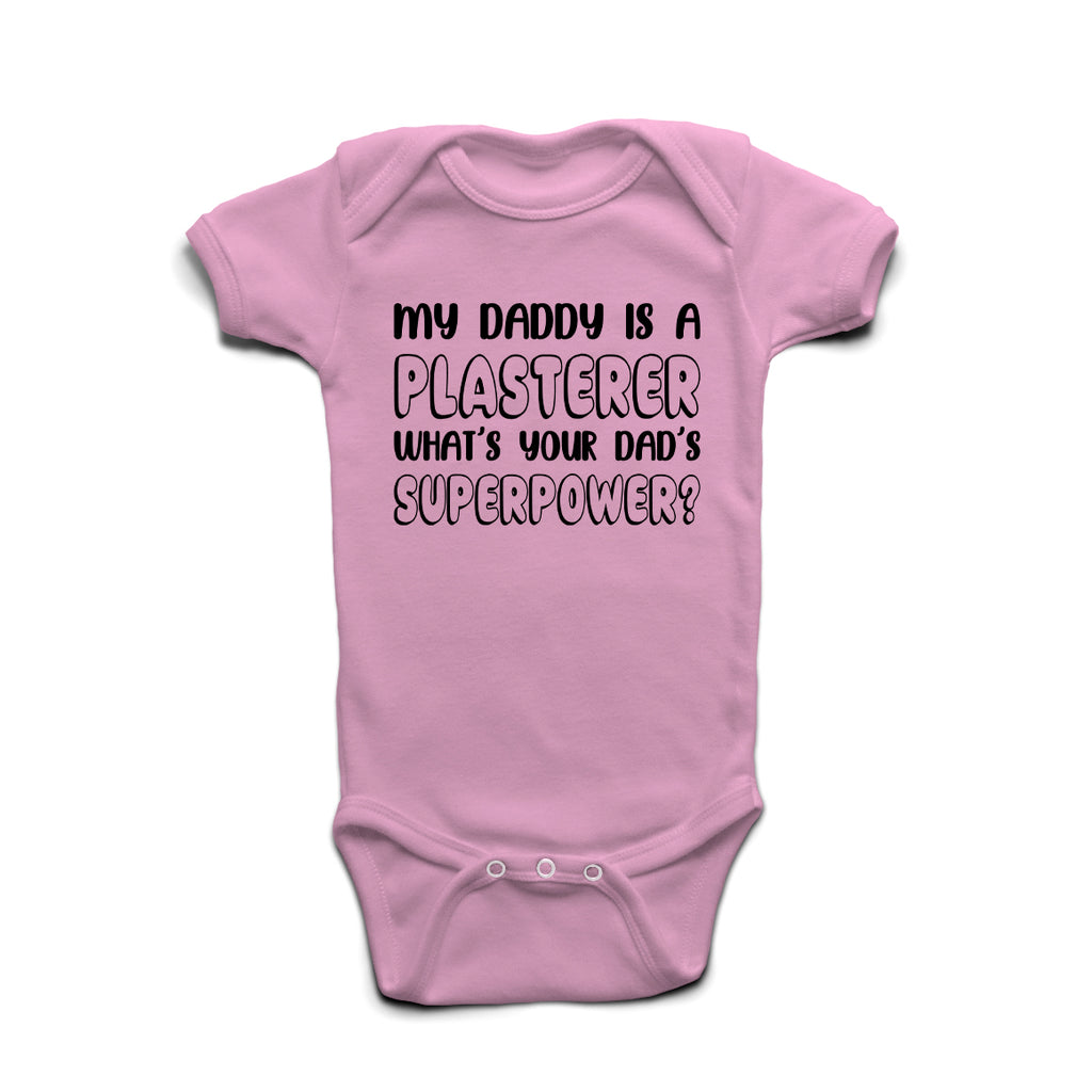 My Daddy Is A Plasterer What’s Your Superpower baby grow in Pastel Pink cotton with bold print.