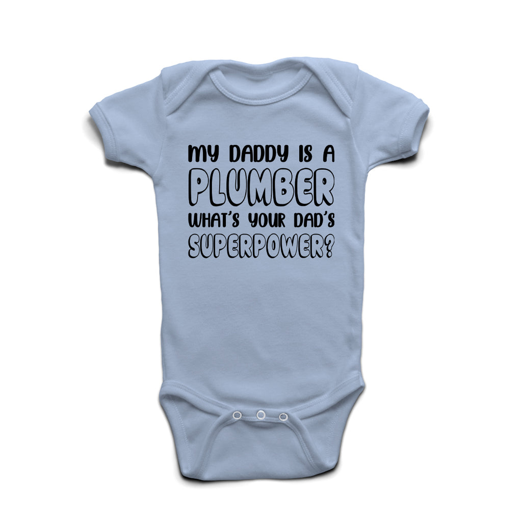 My Daddy Is A Plumber What’s Your Superpower baby grow in Pastel Blue cotton with bold print.