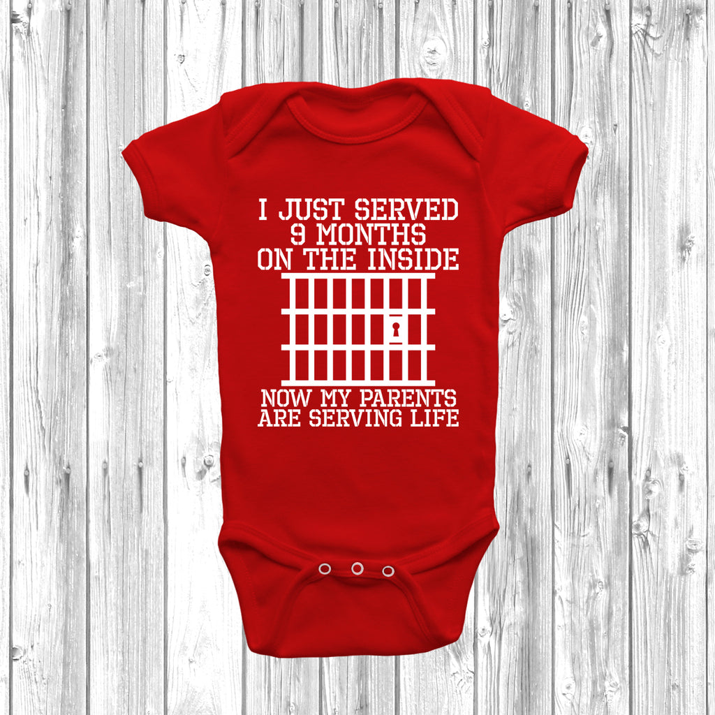Red Funny baby grow with “Just Served 9 Months Inside” slogan in bold print, unisex design for newborn boys or girls.