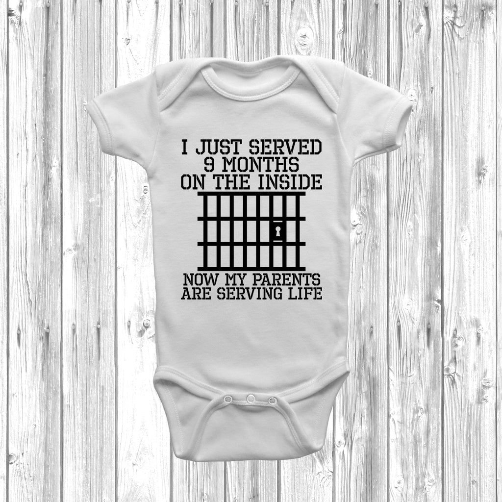 White Funny baby grow with “Just Served 9 Months Inside” slogan in bold print, unisex design for newborn boys or girls.