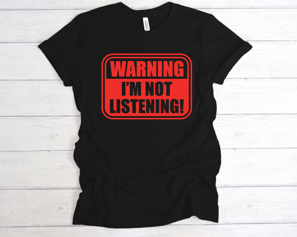 Black unisex cotton t-shirt featuring the bold, sarcastic slogan "Warning I’m Not Listening" across the front. This funny slogan tee is perfect for introverts, sarcasm lovers, and anyone with a sense of humour. Made from soft, breathable fabric, it’s ideal for casual wear, gifting, or making a statement in social or work settings. A great gift for friends, coworkers, or anyone with selective hearing.