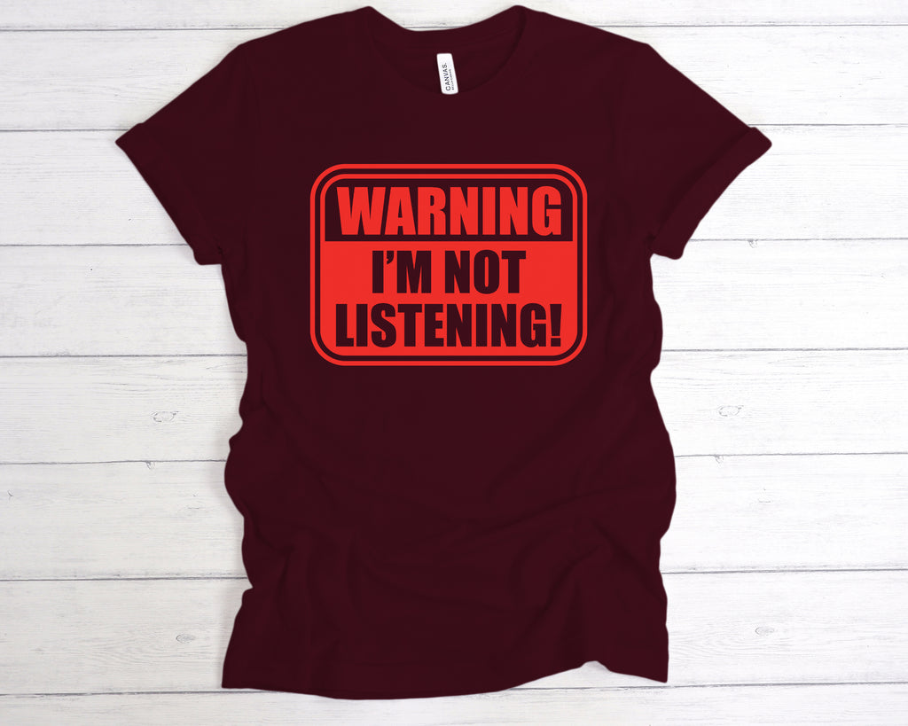 Maroon unisex cotton t-shirt featuring the bold, sarcastic slogan "Warning I’m Not Listening" across the front. This funny slogan tee is perfect for introverts, sarcasm lovers, and anyone with a sense of humour. Made from soft, breathable fabric, it’s ideal for casual wear, gifting, or making a statement in social or work settings. A great gift for friends, coworkers, or anyone with selective hearing.