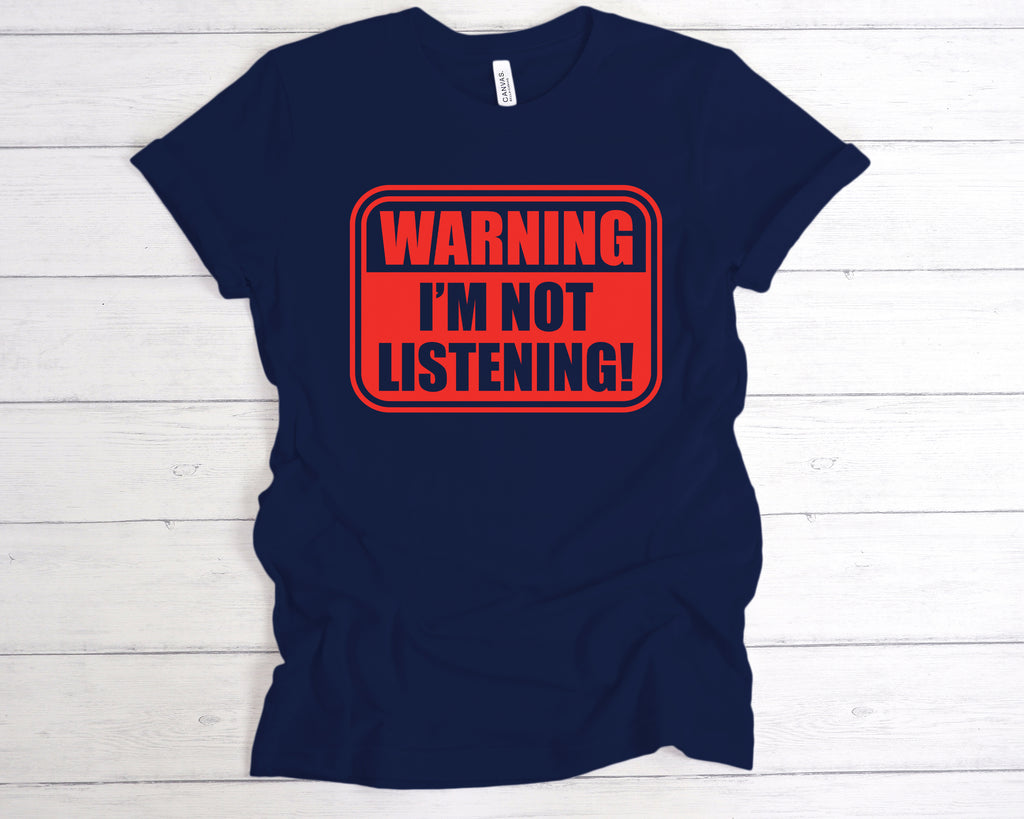 Deep Navy unisex cotton t-shirt featuring the bold, sarcastic slogan "Warning I’m Not Listening" across the front. This funny slogan tee is perfect for introverts, sarcasm lovers, and anyone with a sense of humour. Made from soft, breathable fabric, it’s ideal for casual wear, gifting, or making a statement in social or work settings. A great gift for friends, coworkers, or anyone with selective hearing.