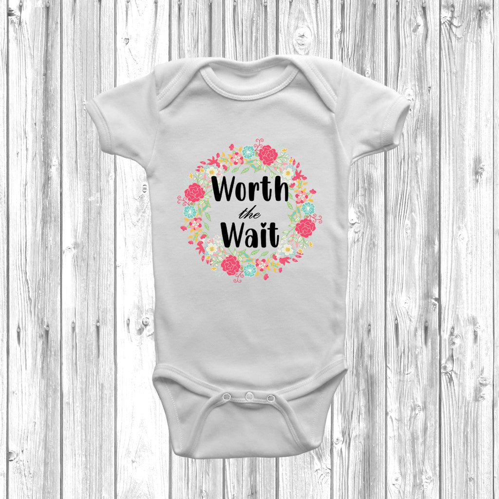 Floral Worth The Wait baby grow with boho floral wreath design on soft cotton bodysuit.