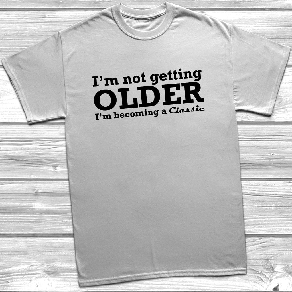 Get trendy with I'm Not Getting Older I'm Becoming A Classic T-Shirt - T-Shirt available at DizzyKitten. Grab yours for £8.99 today!