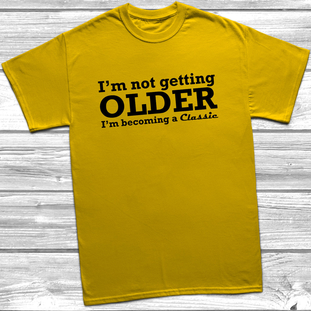 Get trendy with I'm Not Getting Older I'm Becoming A Classic T-Shirt - T-Shirt available at DizzyKitten. Grab yours for £9.49 today!