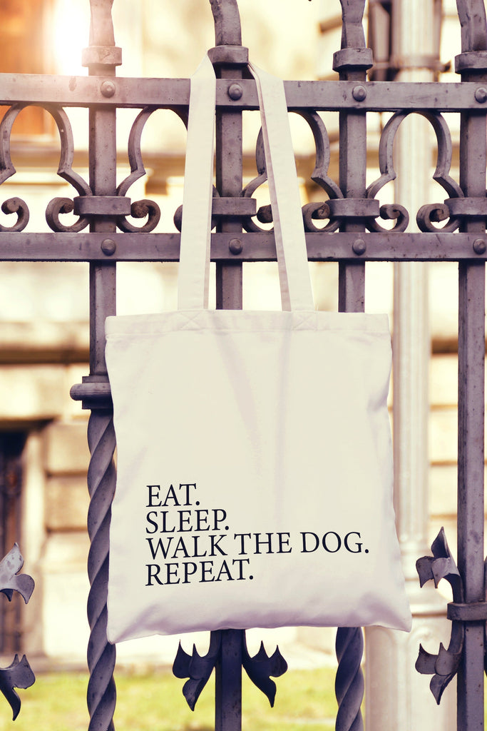 Get trendy with Eat Sleep Walk The Dog Repeat Tote Bag - Tote Bag available at DizzyKitten. Grab yours for £8.99 today!