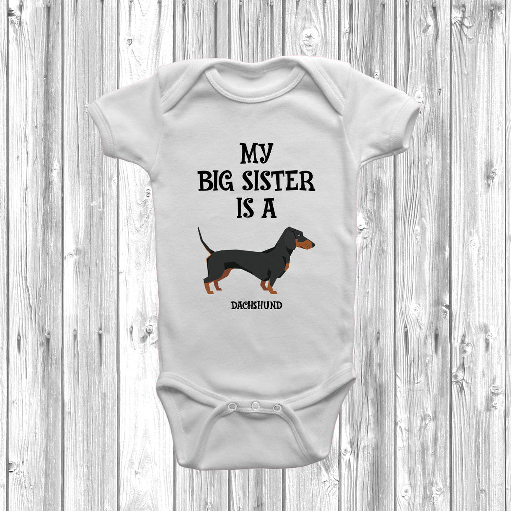 Get trendy with My Big Sister Is A Dachshund Baby Grow -  available at DizzyKitten. Grab yours for £8.95 today!