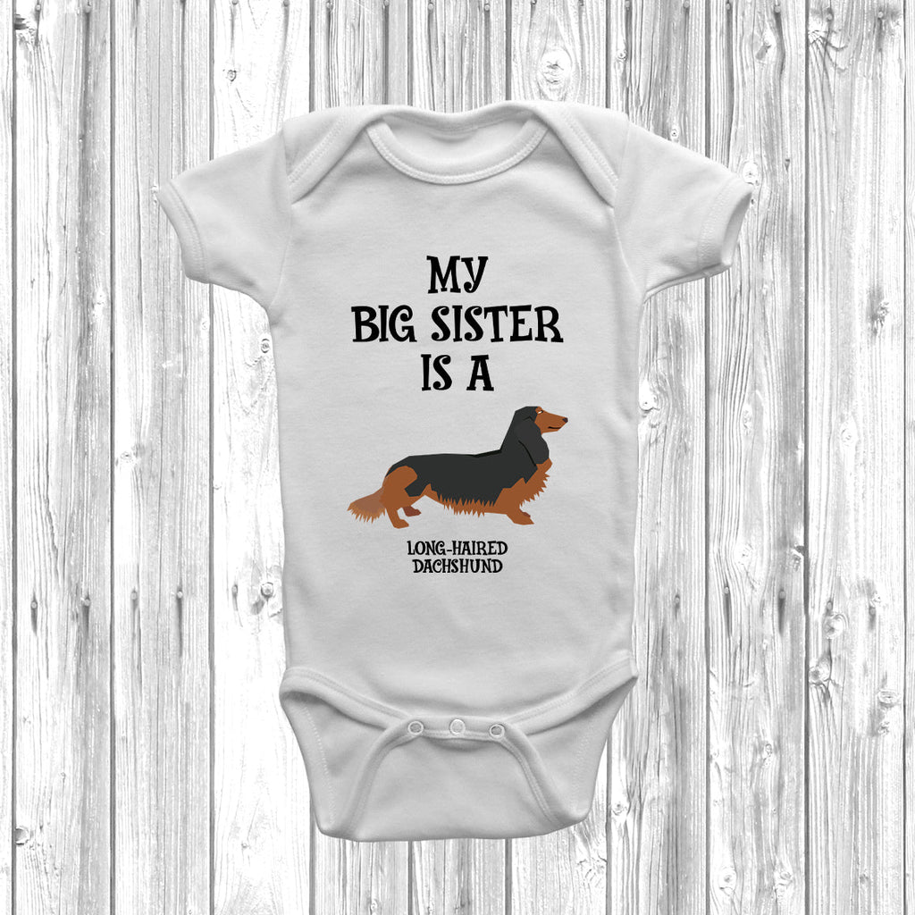 Get trendy with My Big Sister Is A Long-Haired Dachshund Baby Grow -  available at DizzyKitten. Grab yours for £8.95 today!